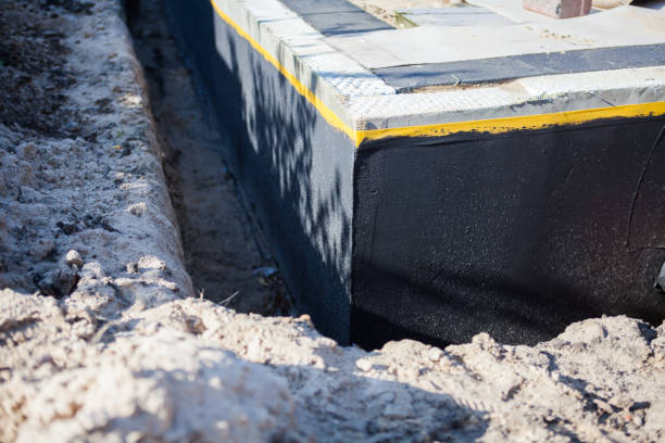 Professional Waterproofing technician working in Woodstock, AL